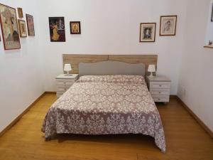 Postel nebo postele na pokoji v ubytování Arco Della Neve Guest House