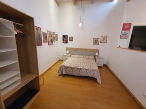 Postel nebo postele na pokoji v ubytování Arco Della Neve Guest House
