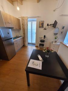 Kuchyň nebo kuchyňský kout v ubytování Arco Della Neve Guest House