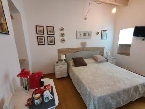 Postel nebo postele na pokoji v ubytování Arco Della Neve Guest House