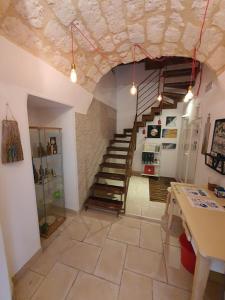 a large room with a staircase in a building with a room at Arco Della Neve Guest House in Bari