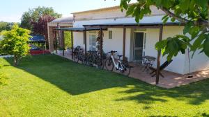 a group of bikes parked outside of a house at Relais Il Giardino fra gli Ulivi in Torino di Sangro