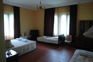 Letto o letti in una camera di Marshal Resort Kobuleti