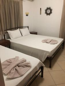 Postel nebo postele na pokoji v ubytování Hotel Avra + 3 fotografie