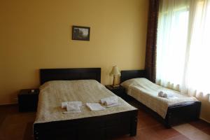 Letto o letti in una camera di Marshal Resort Kobuleti