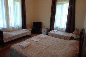Letto o letti in una camera di Marshal Resort Kobuleti