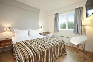 Voodi või voodid majutusasutuse Hotel Klaustur toas