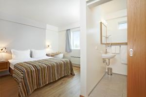 Voodi või voodid majutusasutuse Hotel Klaustur toas