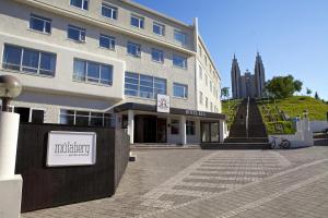 
a large building with a clock on the front of it at Hotel Kea by Keahotels in Akureyri
