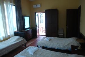 Letto o letti in una camera di Marshal Resort Kobuleti