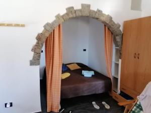 Postel nebo postele na pokoji v ubytování Scialu & Riscialu