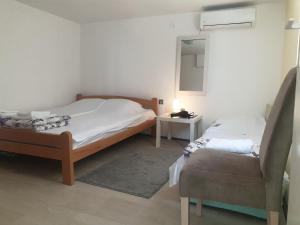 Postel nebo postele na pokoji v ubytování Apartman Bukulja + 34 fotografií