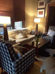a living room filled with furniture and a couch at Off Broadway B & B in Denver