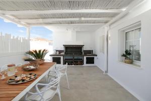 a kitchen with a counter and a stove at Manda Luxury Apartments in Naxos Chora