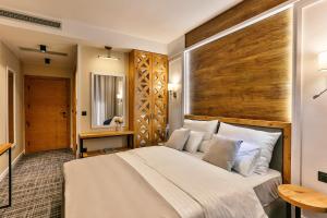 Voodi või voodid majutusasutuse Boutique Hotel Tate By Aycon toas