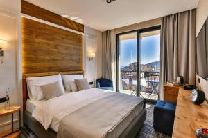 Voodi või voodid majutusasutuse Boutique Hotel Tate By Aycon toas
