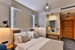 Voodi või voodid majutusasutuse Boutique Hotel Tate By Aycon toas