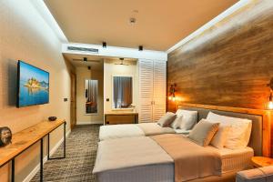 Voodi või voodid majutusasutuse Boutique Hotel Tate By Aycon toas