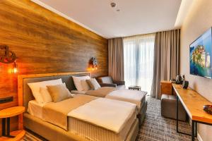 Voodi või voodid majutusasutuse Boutique Hotel Tate By Aycon toas