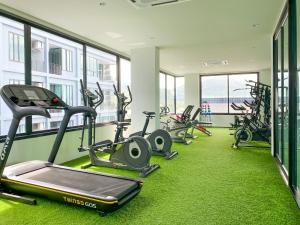 a gym with several treadmills and exercise bikes at ReLife Windy Naiharn by Beringela in Nai Harn Beach