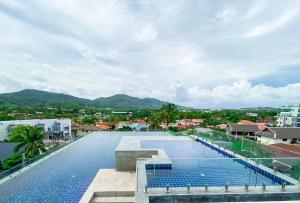 a view of a swimming pool on top of a building at ReLife Windy Naiharn by Beringela in Nai Harn Beach