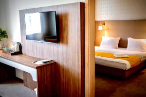 Posteľ alebo postele v izbe v ubytovaní Hotel Nadodrzański Dwór - Nowa Sól
