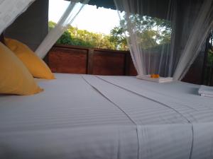 Rúm í herbergi á Dambulla Tree House