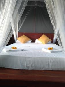 Rúm í herbergi á Dambulla Tree House