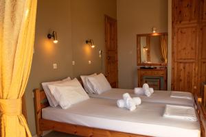 Postel nebo postele na pokoji v ubytování De La Plage Hotel Koroni