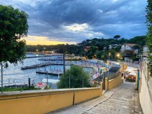 a view of a marina with boats in the water at Appartamenti fronte mare in Castiglioncello