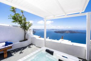 a swimming pool with a view of the ocean at Iatis View Collection in Imerovigli