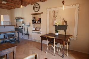 a kitchen and dining room with a table and chairs at B&B La Taccola in Castelnuovo di Val di Cecina