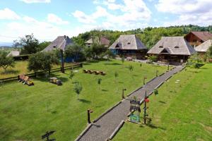 an aerial view of a park with a group of houses at Iz de Maramures Rural Hotel in Şurdeşti