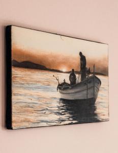 a painting of people on a boat in the water at La Mer Apartment in Rogachevo