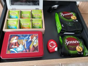 a drawer with snacks and a box of candy at Les Nuits Bonneuilloises Le Mustang in Bonneuil-les-Eaux +5 photos