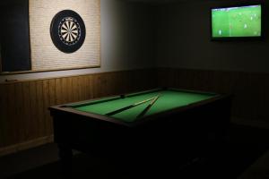 a pool table in a room with a television at The Inn on the Moor Hotel in Goathland