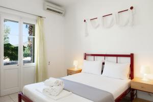 Postel nebo postele na pokoji v ubytování Morpheas Pension Rooms & Apartments