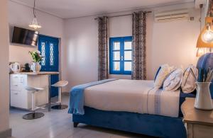 A bed or beds in a room at APOLLON by Akroploro