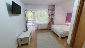 Postel nebo postele na pokoji v ubytování Casa Balint