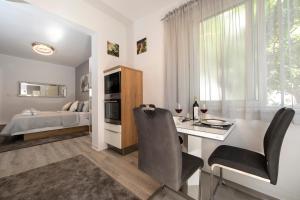 Postel nebo postele na pokoji v ubytování Apartments Ozrenka