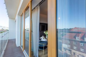 Balkon lub taras w obiekcie Ambria Apartments Platan Tower