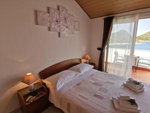 Postel nebo postele na pokoji v ubytování Apartments Marija