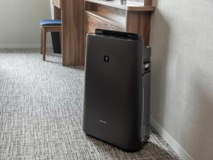 a small refrigerator sitting in the corner of a room at Far East Village Hotel Tokyo Ariake in Tokyo