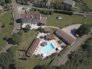 an aerial view of a house with a swimming pool at Le Couvent in Saint-Jean-de Laurs