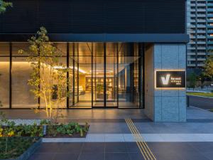 an entrance to a building with a sign on it at Far East Village Hotel Tokyo Ariake in Tokyo
