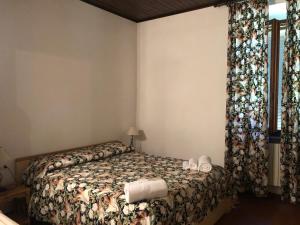 Een bed of bedden in een kamer bij Agriturismo Santa Lorica