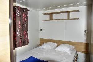 Postel nebo postele na pokoji v ubytování Camping Du Lion