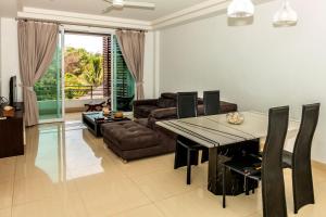 a living room with a table and a couch at Lanta Sport Resort in Ko Lanta