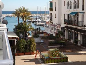 a view of a marina with boats in the water at Duquesa Harbour Club Aparthotel in Manilva