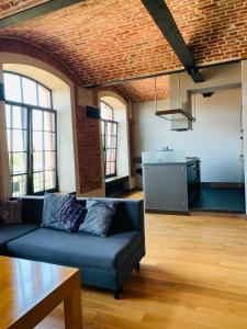 Kuchyňa alebo kuchynka v ubytovaní Apartament Stara Przędzalnia